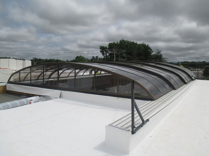 A large rooftop pool enclosure