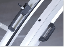 A lockable door handle on a curved pool enclosure frame