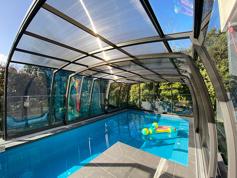 A retractable pool enclosure in Melbourne protects swimmers from ultraviolet radiation