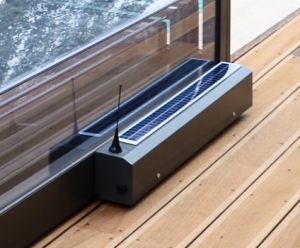 A pool enclosure with a weatherproof motor on it