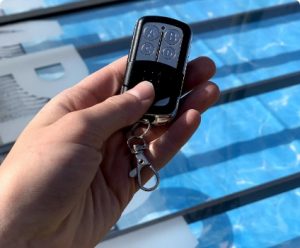 A remote control for an automated pool enclosure