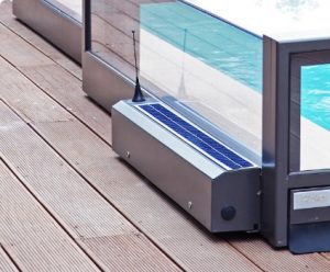A pool enclosure with a solar powered motor attached